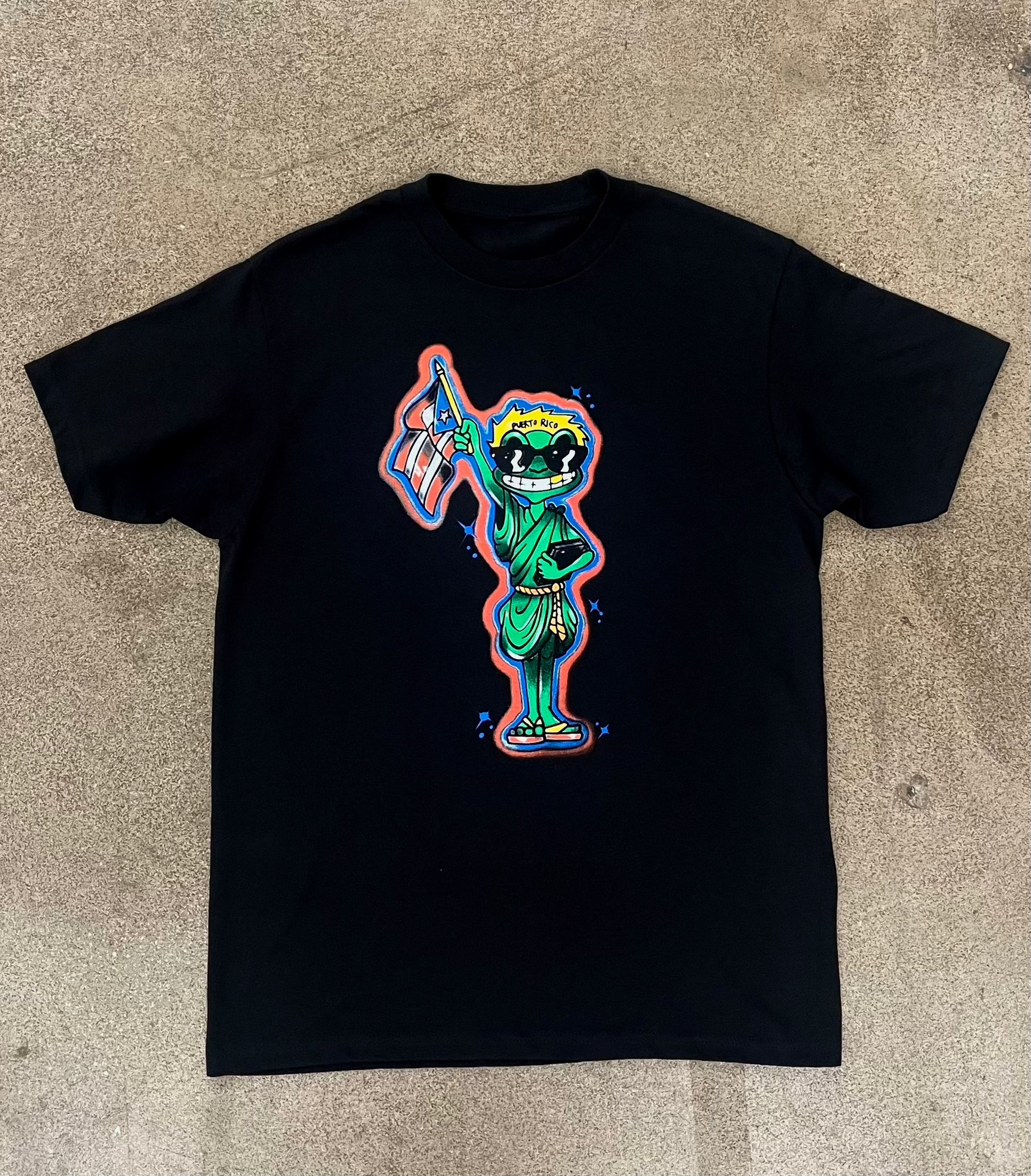 Estatua De Coqui Tee
